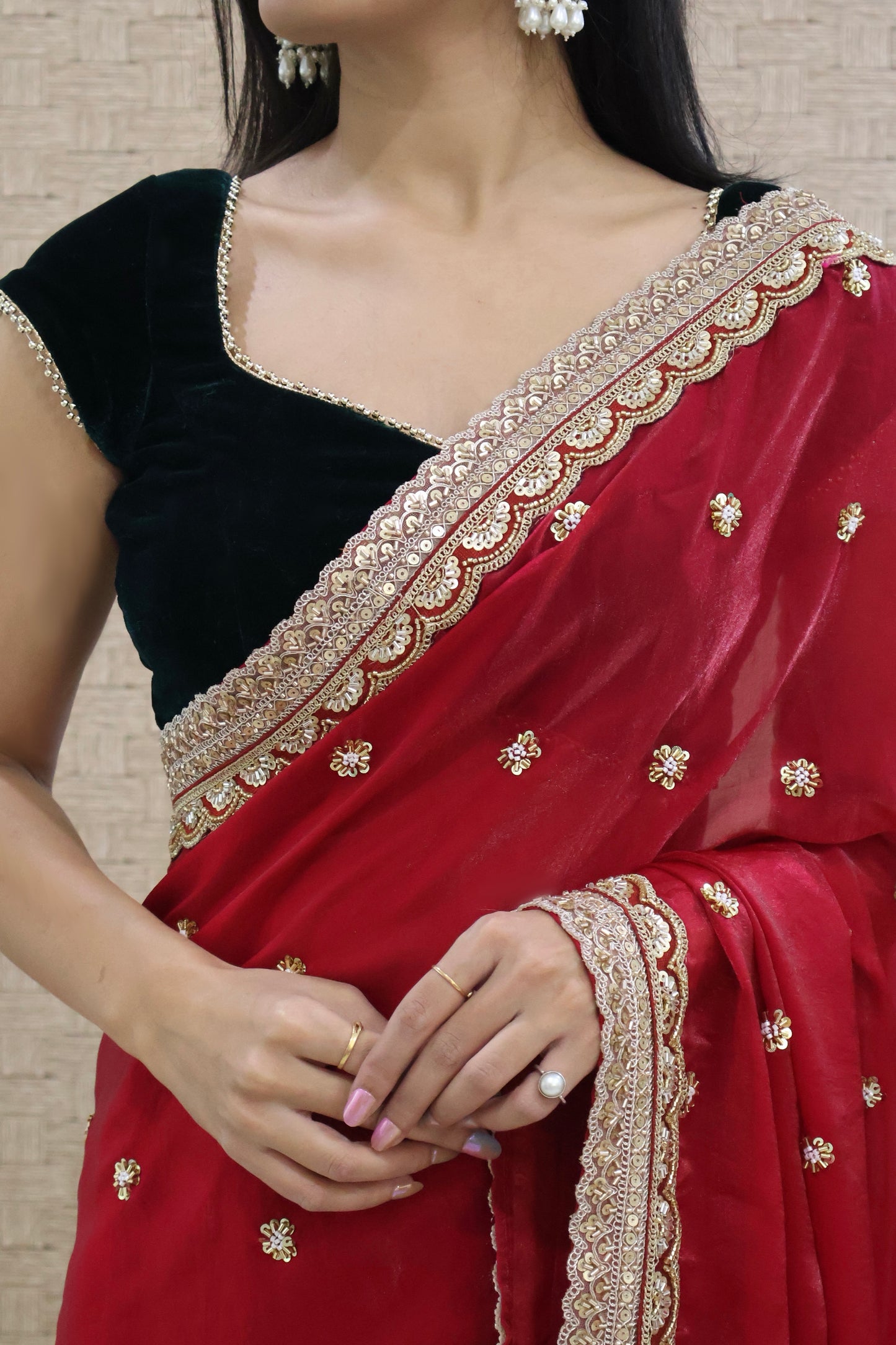 Cherry red embroidered saree with Bottle Green Velvet Blouse